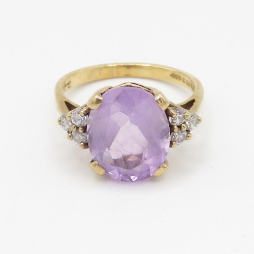 33 - 9ct gold faceted amethyst & cubic zirconia dress ring (3.2g) Size L