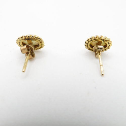 58 - 9ct gold opal stud earrings with scroll backs (1.3g)