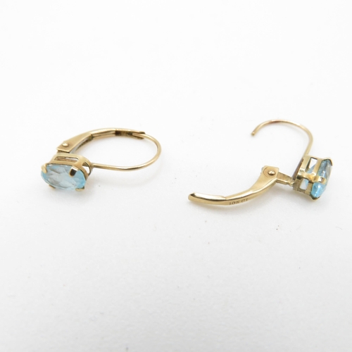 60 - 9ct gold oval cut blue topaz drop earrings (0.7g)