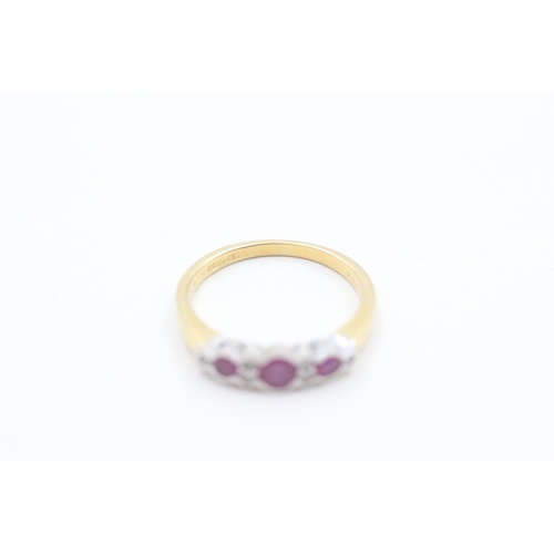 104 - 18ct gold diamond & ruby nine stone ring (2.9g) Size L