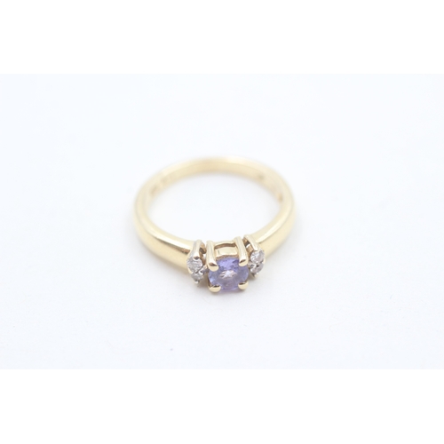 109 - 14ct gold tanzanite & diamond dress ring (2.1g) Size H