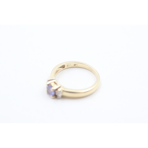 109 - 14ct gold tanzanite & diamond dress ring (2.1g) Size H