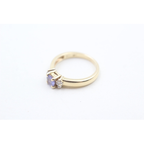 109 - 14ct gold tanzanite & diamond dress ring (2.1g) Size H