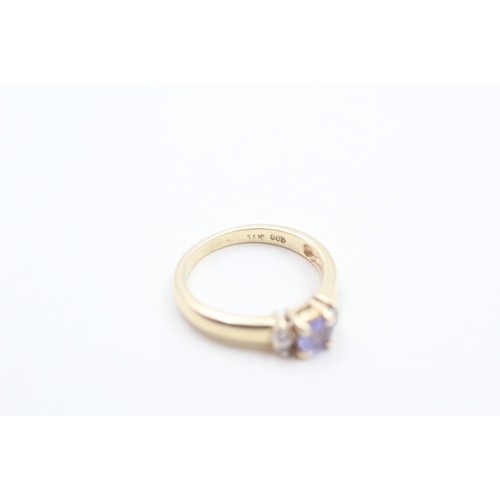 109 - 14ct gold tanzanite & diamond dress ring (2.1g) Size H