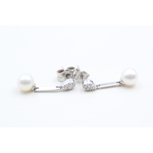 115 - 9ct white gold diamond and cultured pearl set drop earrings (1.8g)