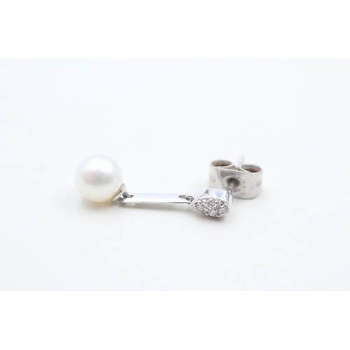 115 - 9ct white gold diamond and cultured pearl set drop earrings (1.8g)