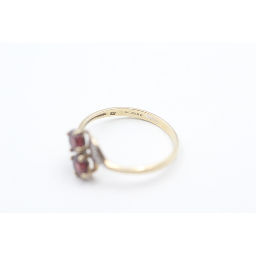 119 - 9ct gold garnet and diamond shoulder set ring (2.8g) Size S 1/2