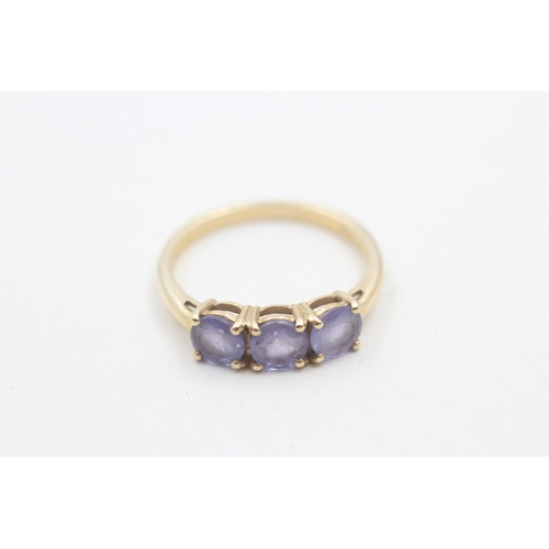 120 - 9ct gold three stone tanzanite ring (2.2g) Size P