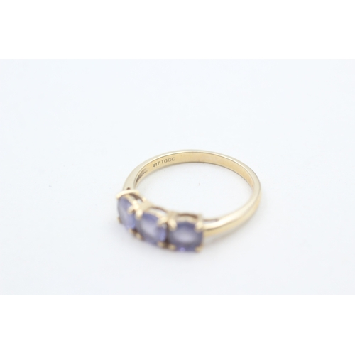 120 - 9ct gold three stone tanzanite ring (2.2g) Size P