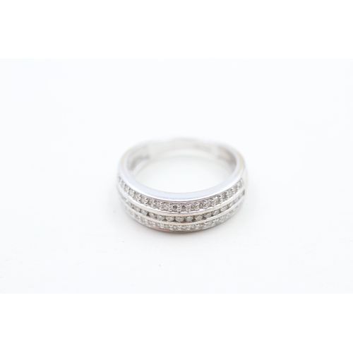 144 - 18ct gold diamond three row half eternity ring (3.3g) Size L