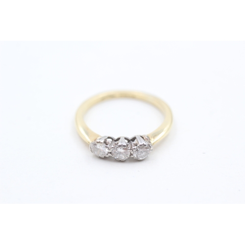 147 - 18ct gold round brilliant cut diamond three stone ring (3.2g) Size M