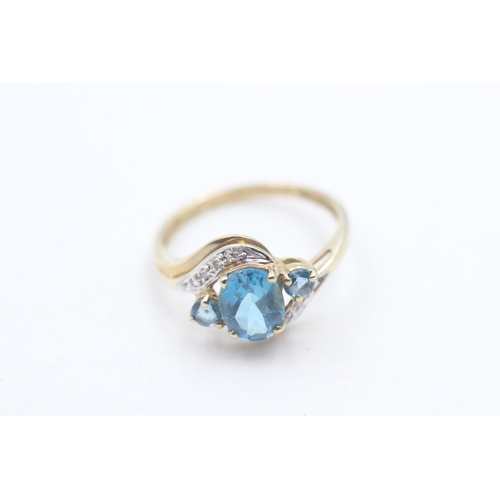 178 - 9ct gold blue topaz and diamond ring (2g) Size O