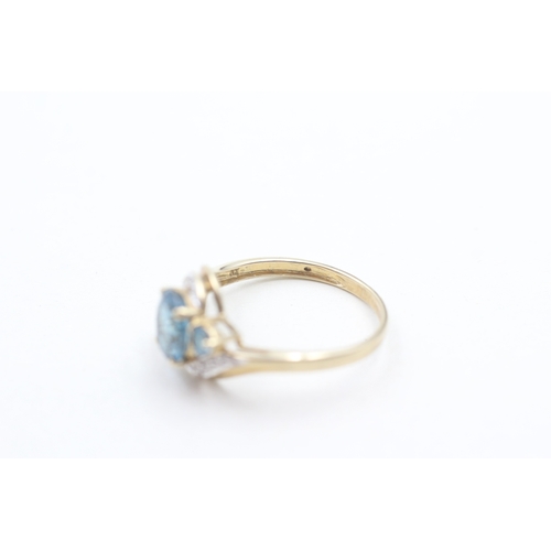 178 - 9ct gold blue topaz and diamond ring (2g) Size O