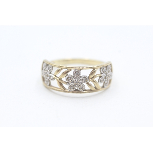 196 - 9ct gold and diamond flower design ring (2.8g) Size S