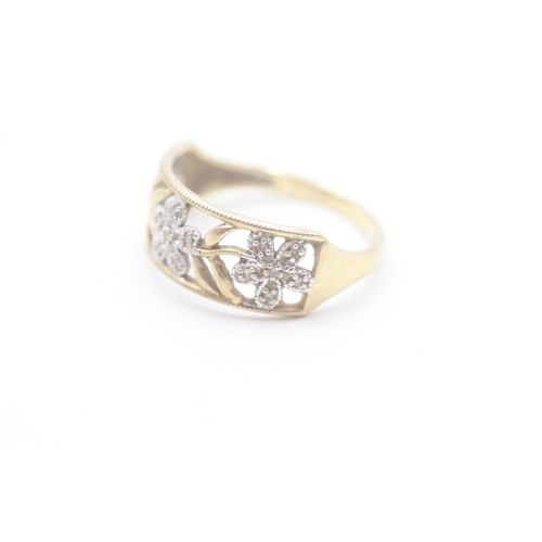 196 - 9ct gold and diamond flower design ring (2.8g) Size S