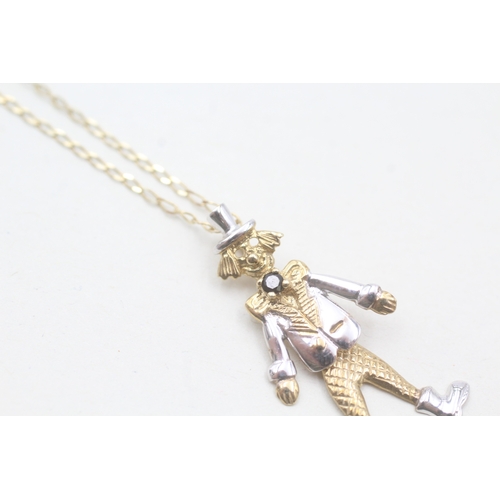 203 - 9ct gold articulated clown with paste pendant on chain (2.3g)