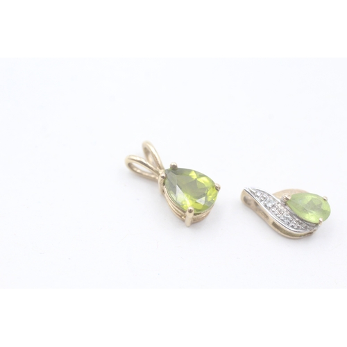 205 - 2 x 9ct gold peridot and diamond teardrop pendants (1.2g)