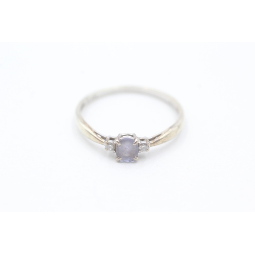 206 - 9ct gold diamond and tanzanite ring (1.4g) Size R