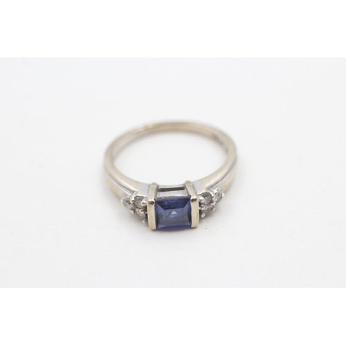 220 - 9ct gold blue gemstone and diamond ring (3g) Size M