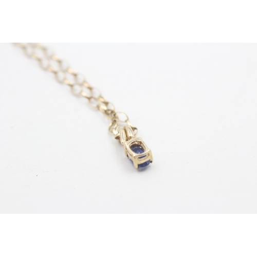 223 - 9ct gold kyanite pendant on oval belcher chain (2.6g)