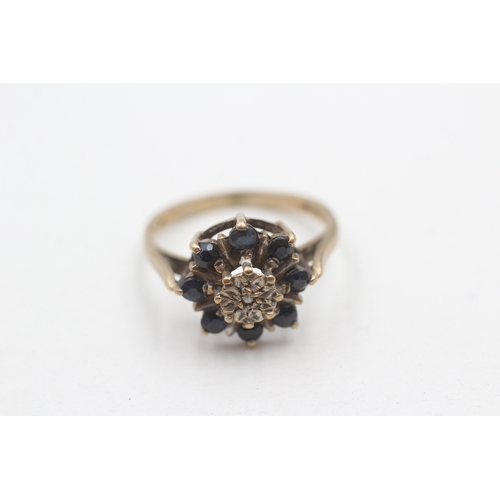 224 - 9ct gold diamond and sapphire flower cluster ring (2.8g) Size L 1/2