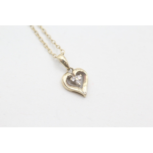 229 - 9ct gold diamond heart shaped pendant on chain (1.7g)