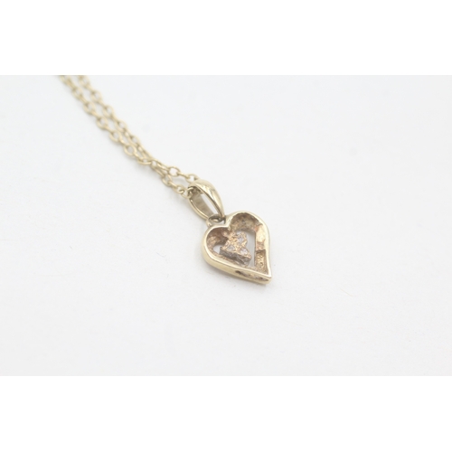 229 - 9ct gold diamond heart shaped pendant on chain (1.7g)