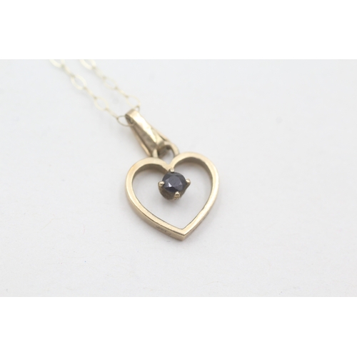 232 - 9ct gold and sapphire heart shape pendant on chain (1.3g)