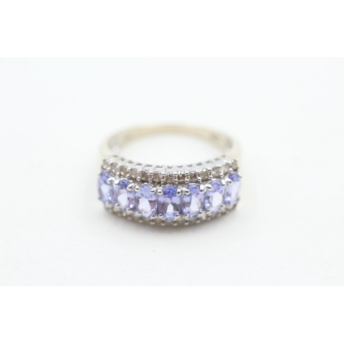 235 - 14ct white gold diamond and tanzanite set dress ring (3.9g) Size P