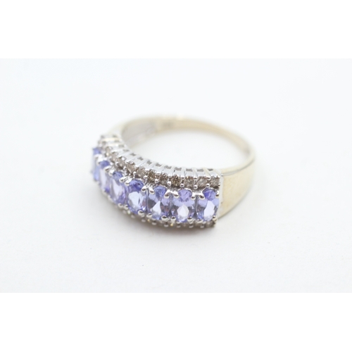 235 - 14ct white gold diamond and tanzanite set dress ring (3.9g) Size P