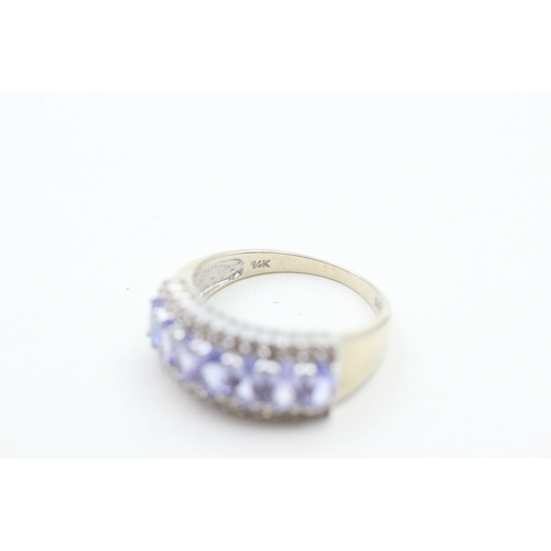 235 - 14ct white gold diamond and tanzanite set dress ring (3.9g) Size P