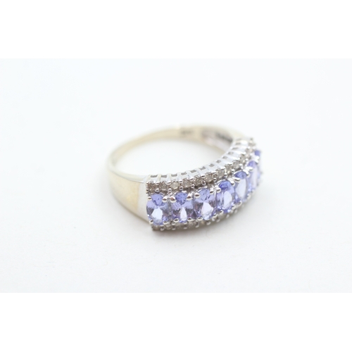 235 - 14ct white gold diamond and tanzanite set dress ring (3.9g) Size P