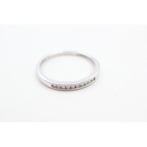 236 - 9ct white gold channel set diamond eternity ring (1.4g) Size N