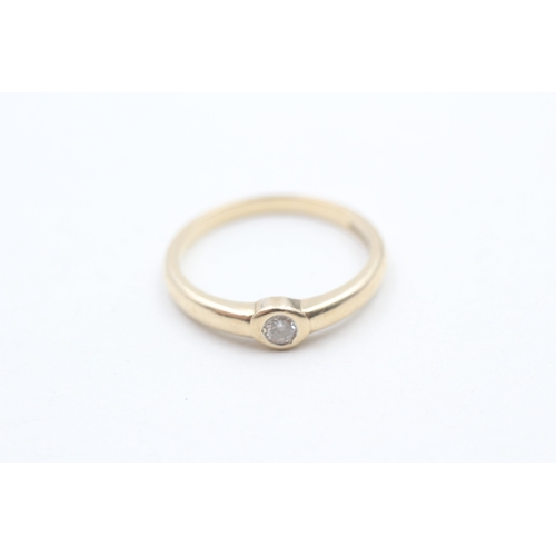 237 - 9ct gold rub over set diamond solitaire ring (1.9g) Size O