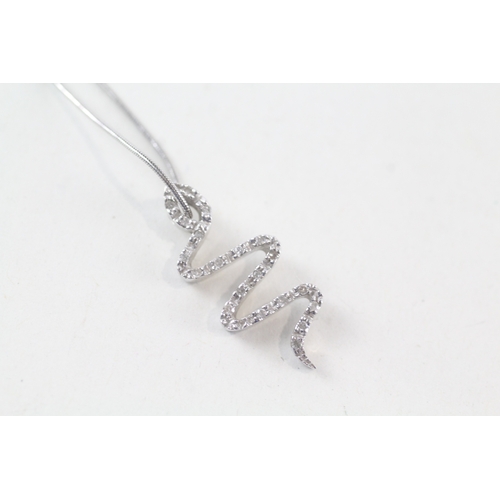 24 - 9ct white gold diamond set snake pendant necklace (3.4g)