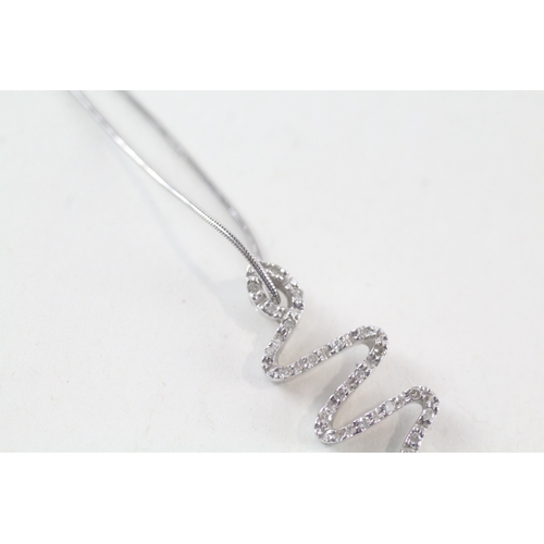 24 - 9ct white gold diamond set snake pendant necklace (3.4g)