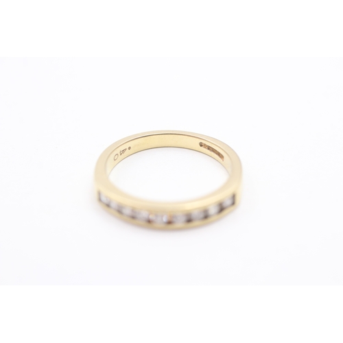 242 - 18ct gold diamond half eternity ring (4.3g) Size O 1/2