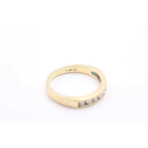 242 - 18ct gold diamond half eternity ring (4.3g) Size O 1/2