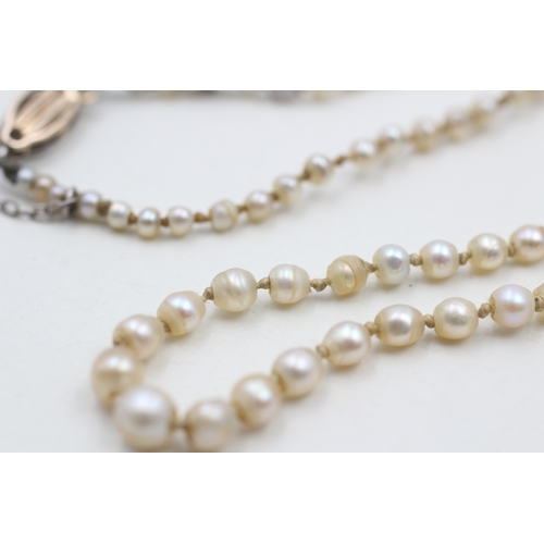 247 - 15ct gold & palladium antique pearl necklace with a diamond clasp (5.3g)