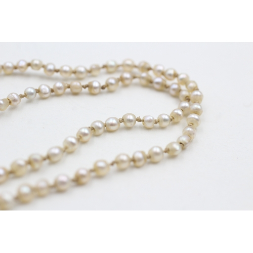 247 - 15ct gold & palladium antique pearl necklace with a diamond clasp (5.3g)