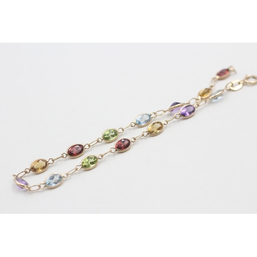 258 - 9ct gold garnet, amethyst, citrine, peridot and topaz bracelet (2.5g)