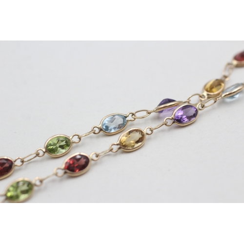 258 - 9ct gold garnet, amethyst, citrine, peridot and topaz bracelet (2.5g)