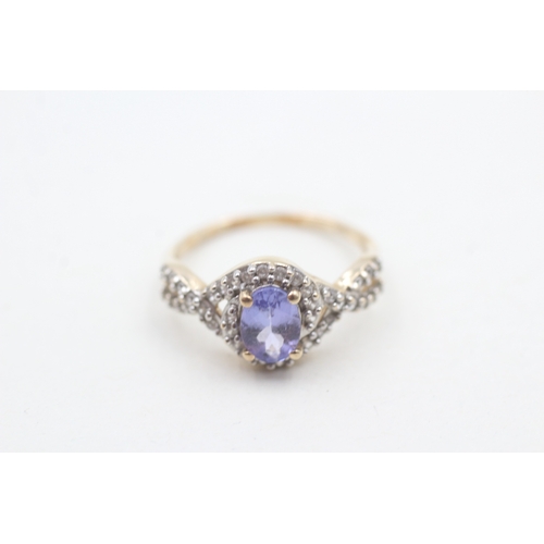 30 - 9ct gold tanzanite & white gemstone dress ring (2g) Size L 1/2