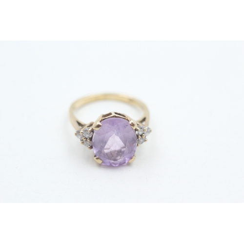 33 - 9ct gold faceted amethyst & cubic zirconia dress ring (3.2g) Size L