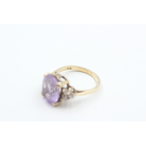 33 - 9ct gold faceted amethyst & cubic zirconia dress ring (3.2g) Size L