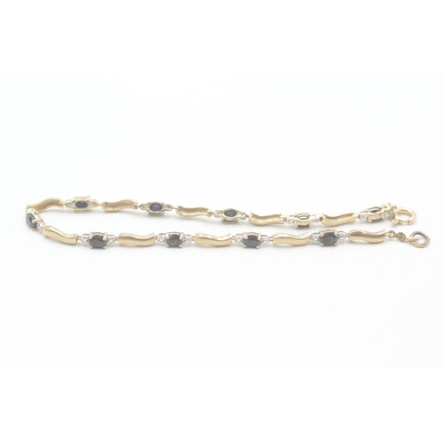 65 - 9ct gold diamond and sapphire bracelet (4.7g)