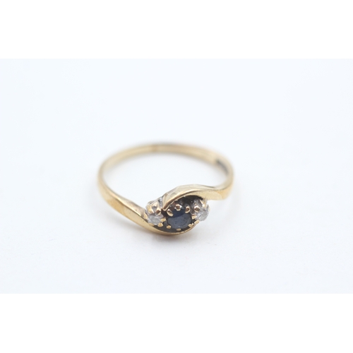 79 - 9ct gold diamond and sapphire trilogy ring (1.5g) Size K 1/2