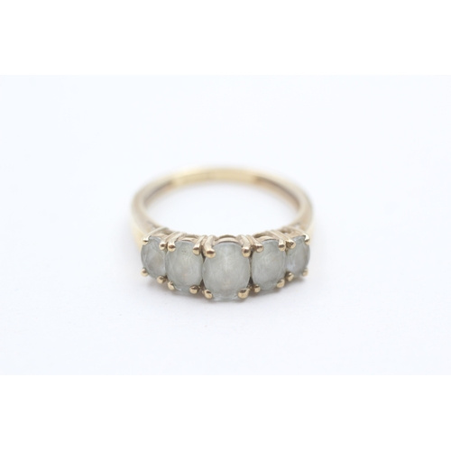 87 - 9ct gold and aquamarine ring (2.5g) Size O 1/2