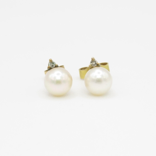 109 - 9ct gold cultured pearl & diamond stud earrings (1.1g)