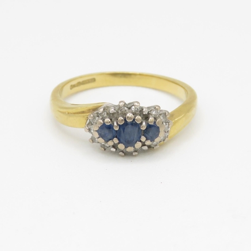 150 - 18ct gold diamond and sapphire halo trilogy ring (3.8g) Size M 1/2